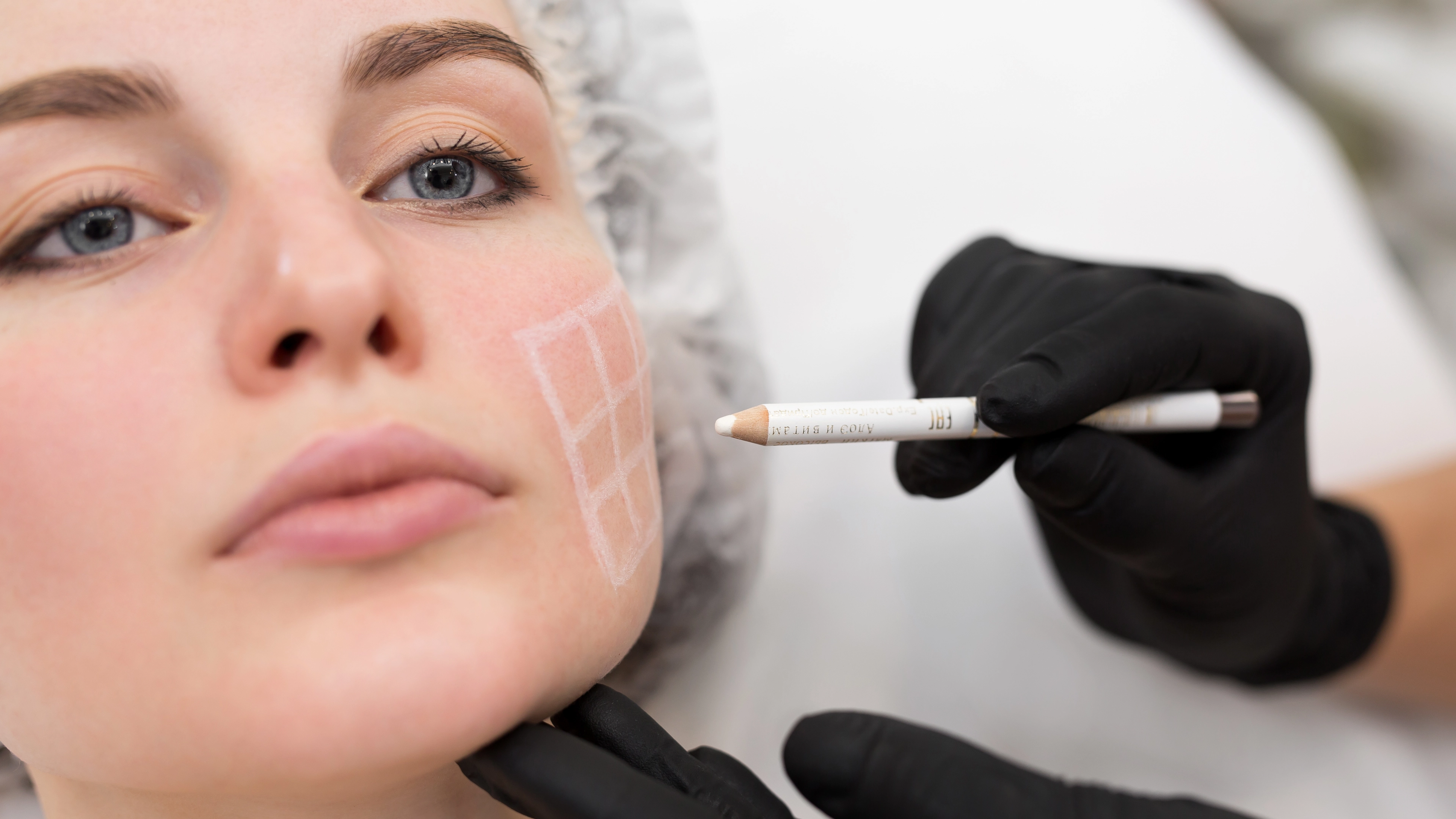 beautician draws the contours of a white pencil 4k